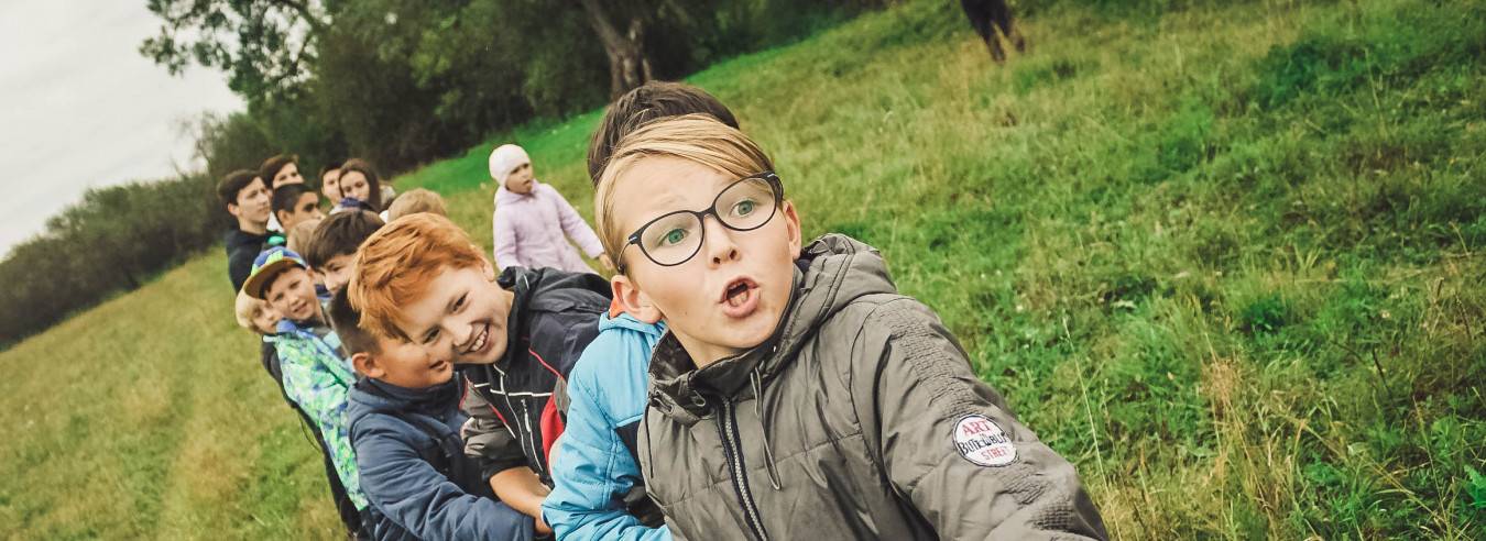 Students playing tug of war outside