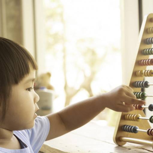 Child learning with an abacus