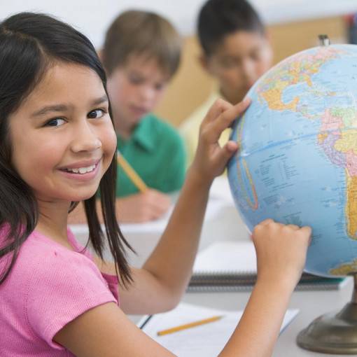 Elementary student with globe