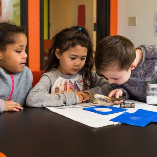 Elementary student with magnifying glass